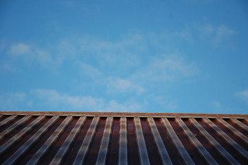 Blue sky and hoarfrost on the roof