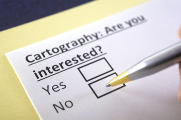 Obraz premium One person is answering question about cartography.