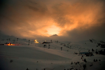 Sun setting over Les Arcs 2000 paradiski ski area Massif de La Vanoise, high Tarentaise valley Savoie France