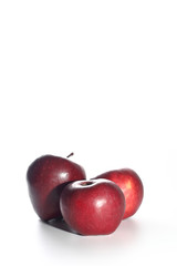 Three red apples with white background