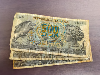 Italian lire notes on a plain background, landscape view 
