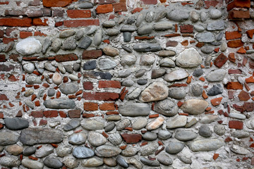 old wall made with peebles and bricks with copy space for your text,