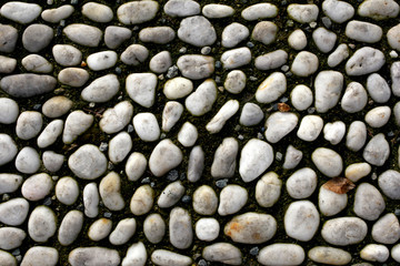 old pavement made with peebles with copy space for your text