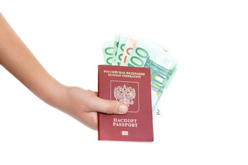 Russian passport with foreign money in hand.