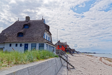 Historical villas in the nature reserve Graswarder on the beach in Heiligenhafen at the Baltic Sea,...
