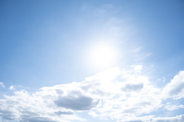 blue sky with sun and few clouds