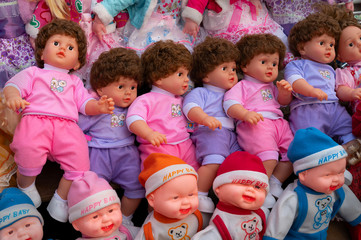 Beautiful cute baby dolls for sale at retail shop at Christmas market, New Market area, Kolkata, West Bengal, India.