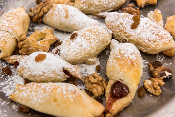 Tasty baked and sprinkled with powdered sugar bagel and bun