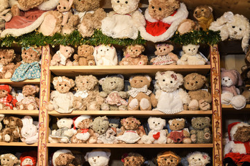 A lot of stuffed toys on shop shelves, for sale in a children store
