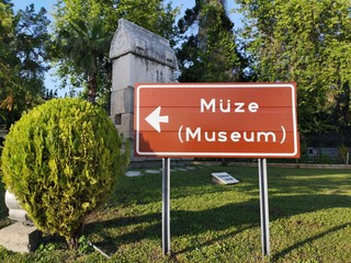 Museum direction sign in green area