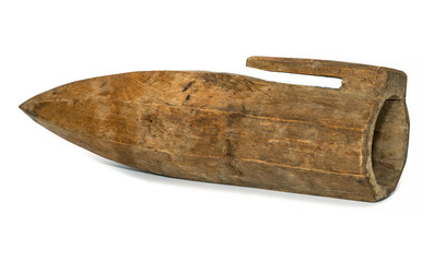 Obraz premium Old authentic wooden objects used by our ancestors. Wooden container for abrasive stone used to sharpen a hand scythe when mowing hay. Isolated on a white background.