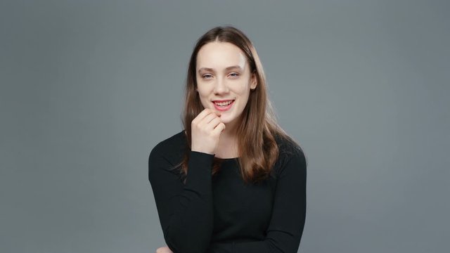 Video of plotting girl in black shirt