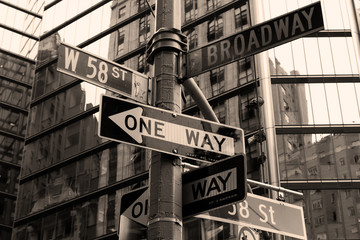 Street sign in New York City in sepia.