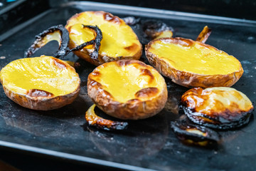 baked burnt potato with onion slices