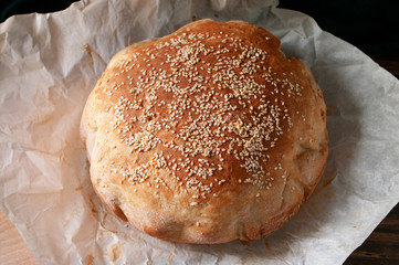 Bread with sesame seeds on top, sourdough dough, home made bakery. Handmade.