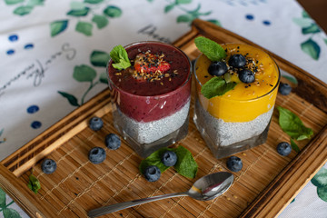 Fresh mango smoothie with blueberries. Healthy diet nutrition. Vegetarian healthy food. Homemade chia pudding. Superfood for strong immunity. Concept of vegetarian breakfast