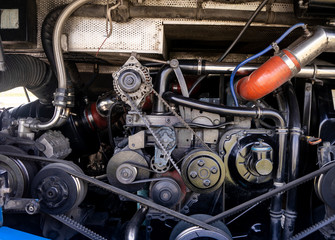 View on pulley and belts on a bus engine