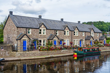 Boat docked on a riverside in Brecon town, Wales, United Kingdom, Great Britain