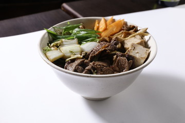 Bowl with vegetables, mushrooms and beef