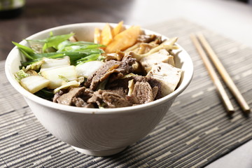 Bowl with vegetables, mushrooms and beef