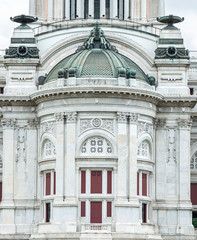 Beautiful ancient carved marble statues sculptures architecture with copper roof tiles decorated outside Ananta Samakhom Throne Hall Bangkok, Thailand
