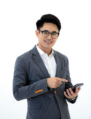 Portrait of young asian business man standing studio isolated on white background pointing a mobile phone on hand and smiling with confident .