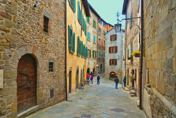 Detail of narrow street in old historic alley in the medieval village of Anghiari near city of Arezzo in Tuscany, Italy 
