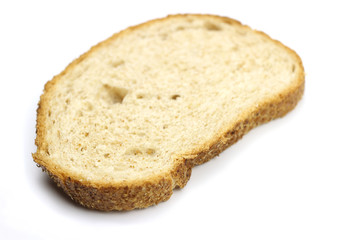 A piece of bread is isolated on a white background