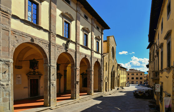 Fototapeta  Detail of main square with cathedral entrance in old historic alley in the medieval village of Sansepolcro near city of Arezzo in Tuscany, 