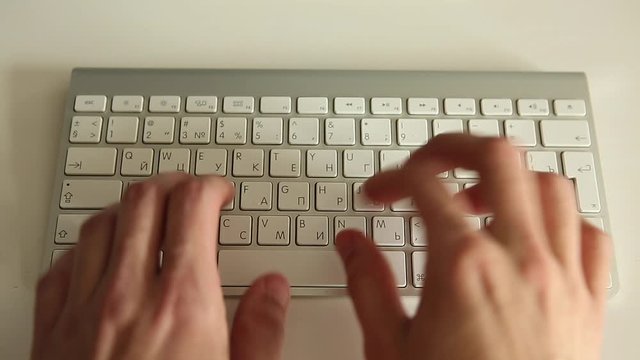 hands typing on keyboard. Man working at the computer. Office worker