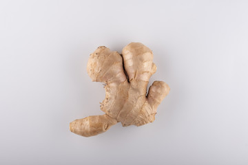 Close-up of ginger root on white background. Shallow dof - 349242526