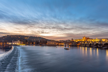 Fototapeta na wymiar Wide view of Vltava river with Charles bridge and Prague Castle.