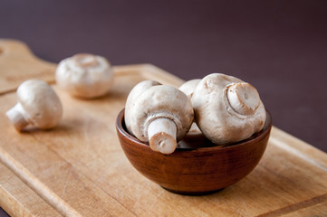 Still life: clay Cup with mushrooms on a cutting Board
