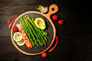 Diet menu. Healthy fresh vegetables - salmon and asparagus, tomatoes, avocado. Vegan food. Flat lay. Banner. Top view