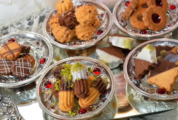 Homemade shortbread cookies lying on a white Silver platter and steel glass surface. Baking and cooking