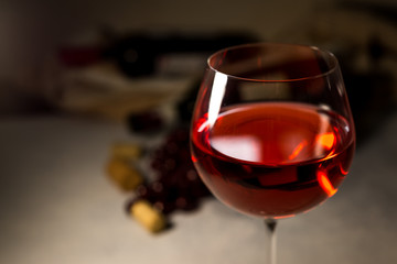 Red wine. Bottle and glass of red wine and ripe grapes. Design with space for your text. Vintage style