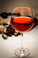 Red wine. Bottle and glass of red wine and ripe grapes. Design with space for your text. Vintage style