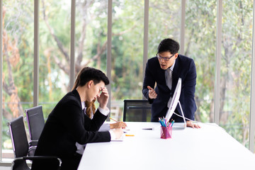 The supervisor blamed the intern for the wrong job at the meeting. Young people work in modern...