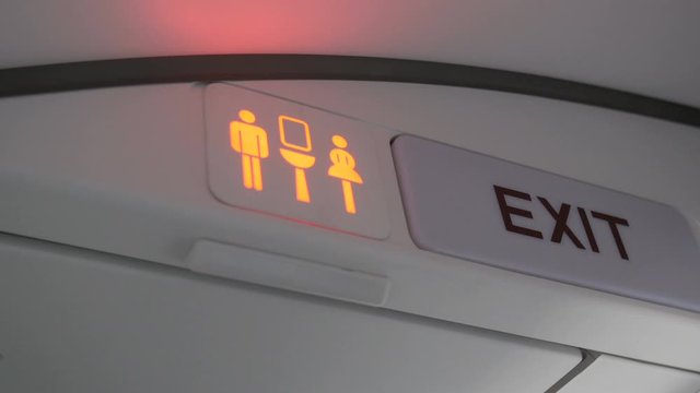 Airplaine toilet sign green to red or available to occupied.