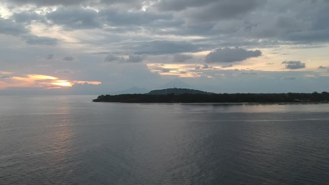 takeoff over the island of gili meno and gili travangan on the background visible Agung volcano