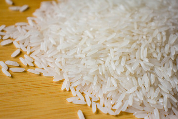 Close up of grains of jasmine rice, white long rise. White long grain rice, background image.