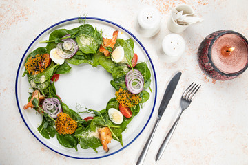 Beautiful salad on a white dish and a white background