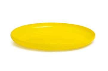 Yellow flying disc toy on white background isolation