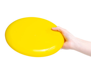 Yellow flying disc toy in hand on white background isolation