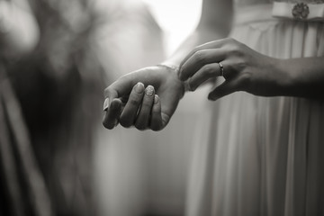 Hands of a young girl with a beautiful manicure, black and white photo
