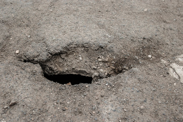 A hole in the asphalt, Danger. Road destruction