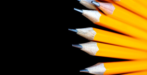 Still life, business, education concept. Pencils on black background