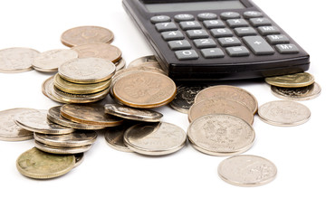 The coin with calculator on white background, concept of calculating expenses, incomes and expenses.