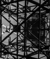 The elevator.
Black and white picture of a massive metallic structure who have the shape of an industrial elevator.