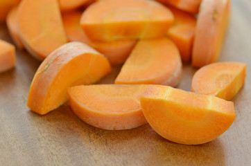 Cut carrots thick on wooden table